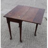 A late Georgian oak single drop leaf side table, on turned supports and pad feet, 29" wide