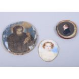 A 19th century portrait on ivory of a young gentleman, another of a young girl, and an early 19th