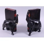 A pair of carved hardwood and ebonised elephant book ends, 7 3/4" high, and a mahogany stool, on