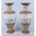 A pair of Royal Doulton stoneware baluster vases, by Hannah Barlow, with sheep dog, horses and
