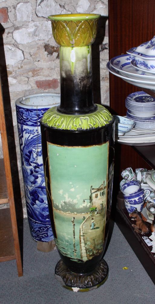 A Bretby Art Pottery landscape decorated vase, 38" high (damages)