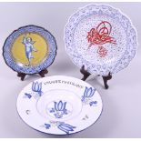 A Majolica plate with armorial decoration on a yellow ground, 9" dia, a Delft bowl with tulip