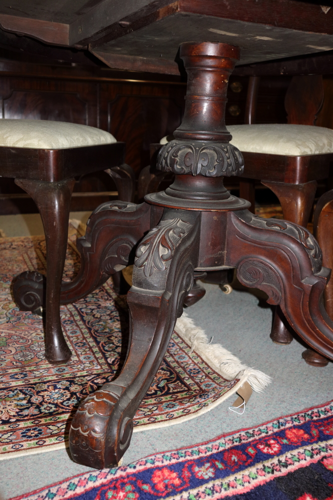 A 19th century figured walnut oval loo table, on turned and carved quadruple splay supports, 53" - Image 2 of 3