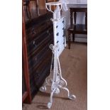 A Victorian white painted adjustable lamp / stand, on splay supports