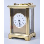 A French gilt metal eight-day carriage clock with seven jewel movement, white enamel dial and