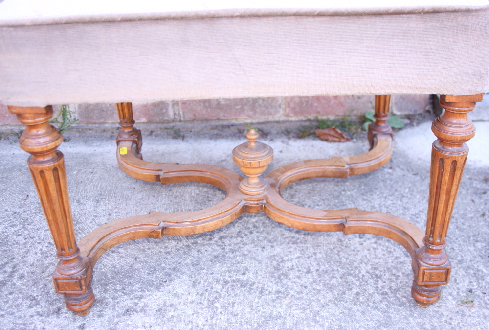 A carved walnut stool of Louis XVI design with needlepoint seat, on square taper supports united - Image 2 of 2