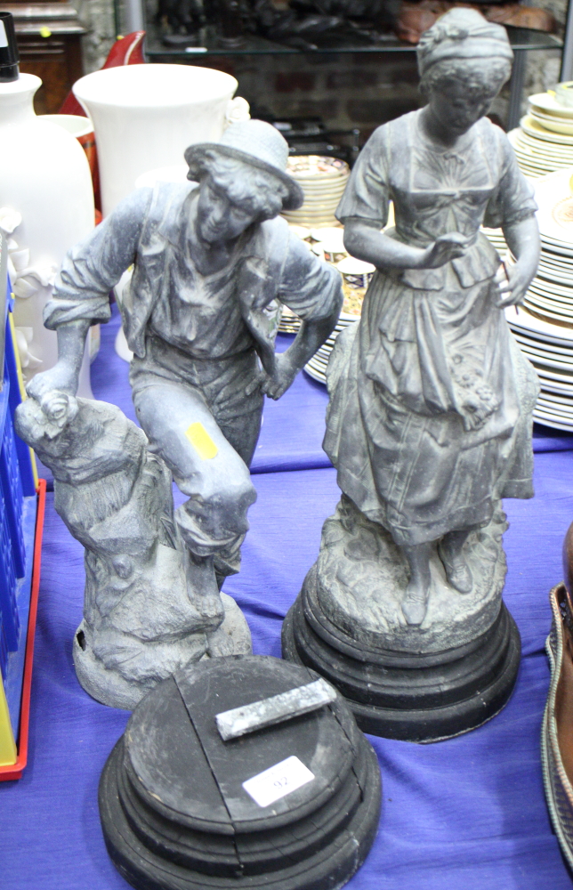 A pair of late 19th century spelter figures of farm labourers, 16" high, on ebonised bases