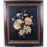 An embroidery of flowers and foliage, in a polished as walnut and gilt frame, 21" x 17"