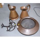 Two copper flagons, a copper alms bowl and a cast iron harness rack / saddle bucket