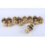 A set of nine pairs of early 19th century brass and copper doorknobs with spindles