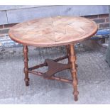 A 19th century oak parquetry topped two-tier cricket table, 25" dia x 20" high