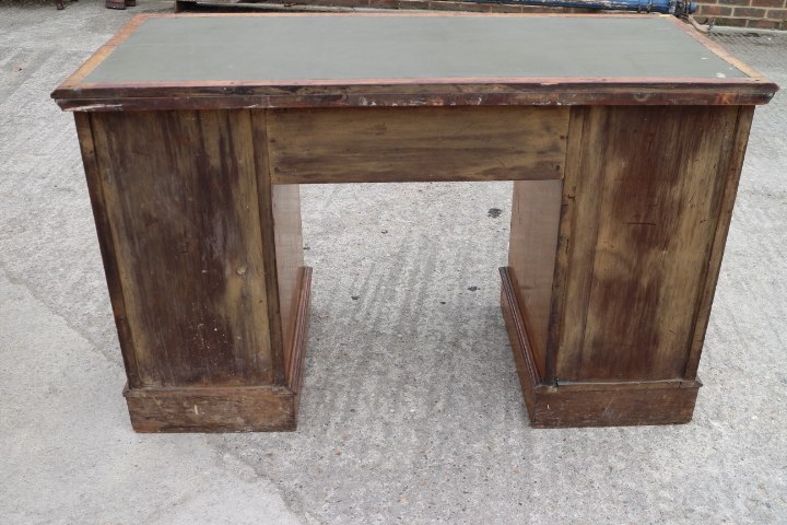 An oak double pedestal desk with green leather top over nine drawers, on block base, top 48" x 22" - Image 2 of 2