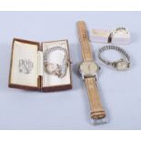 An 18ct gold and diamond five stone dress ring, a gentleman's Buler wristwatch and two lady's