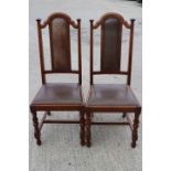 A set of six early 20th century walnut high back standard dining chairs, upholstered in leather,