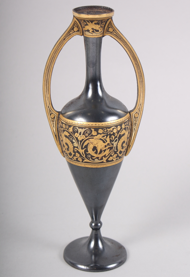 A 1930s Toledo ware two-handled vase, on circular foot with dragon scroll decoration, 7 1/8" high