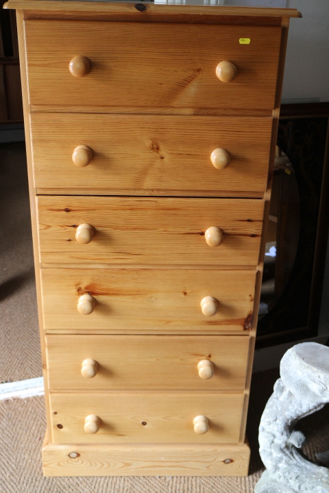 A modern pine chest of six long drawers, on block base, 24" wide