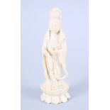 An early 20th century Chinese carved ivory figure of Kuan Yin standing on a lotus flower, 5 3/4"
