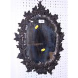 A Victorian Coalbrookdale design oval wall mirror, decorated ivy, 20" x 14"