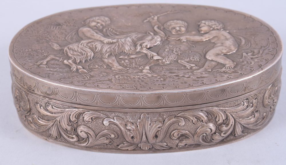 A Continental silver box with hinged lid, decorated in cherubs and a ram, 8.7oz troy approx, and a - Image 2 of 3