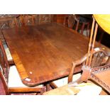 A Regency banded mahogany rectangular topped breakfast table, on turned column and quadruple splay