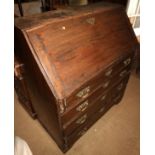 A late 19th century oak fall front bureau with fitted interior over four long graduated drawers,