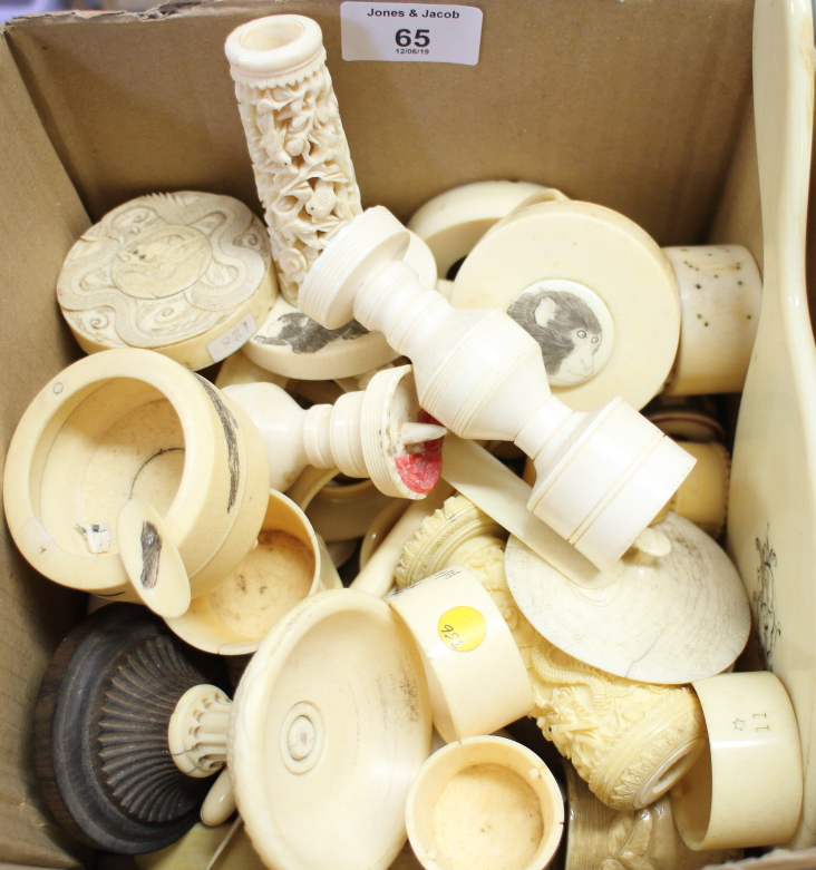 A quantity of ivory objects, including candlesticks, napkin rings, etc