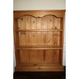 A pine open bookcase, on block base, 30" wide