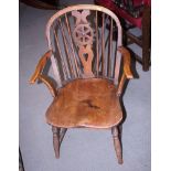 A 19th century fruitwood ash, elm and beech Windsor wheelback elbow chair