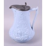 A 19th century blue glazed relief moulded jug, decorated exotic animals and war trophies (Europe and