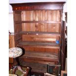 A Victorian mahogany wardrobe, the interior fitted trays enclosed two Gothic panel doors, on