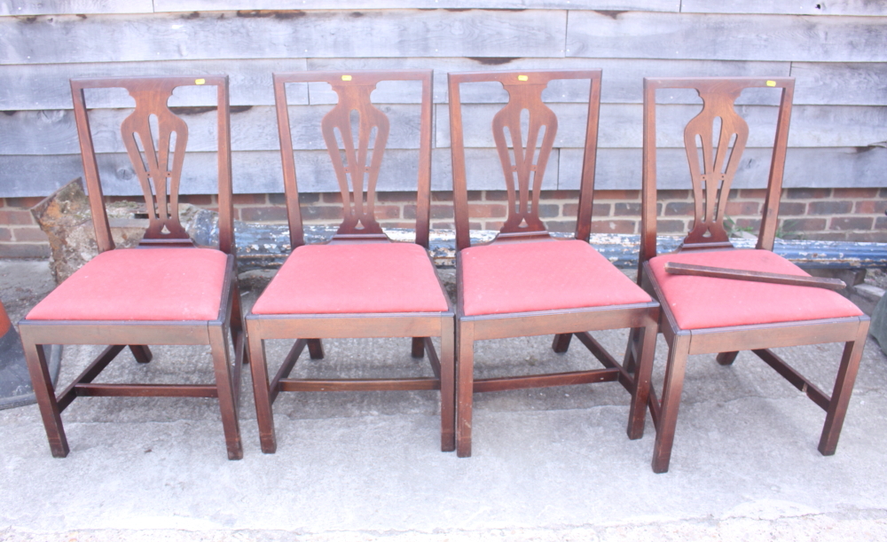 Four splat back dining chairs with drop-in seats, upholstered in a red fabric, on square chamfered