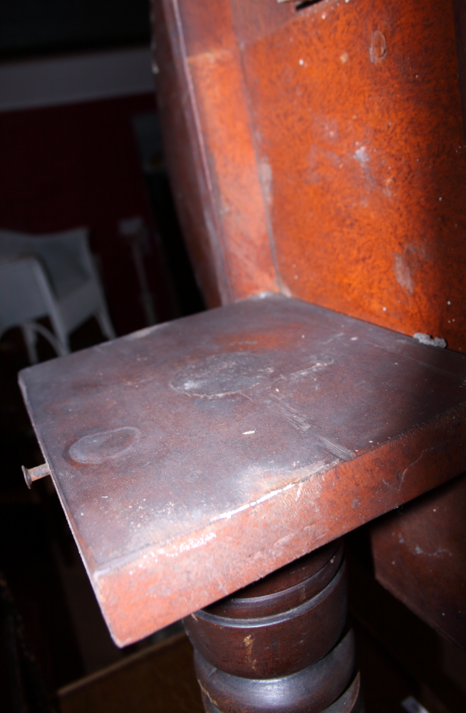 An early 20th century oak tilt top circular table, on three splayed supports (heavy staining to - Image 2 of 3