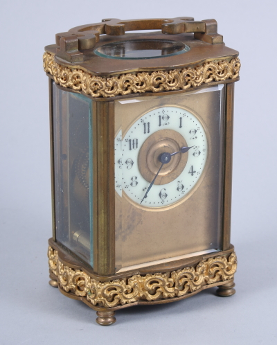 A French gilt cased carriage clock with white enamel dial and Arabic numerals, 4 3/4" high