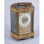 A French gilt cased carriage clock with white enamel dial and Arabic numerals, 4 3/4" high