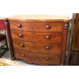 A Victorian mahogany bowfront chest of two short and three long graduated drawers with flanking