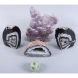A carved amethyst plaque of birds and flora, a carved jade ball and three crystal geodes