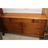 A 20th century campaign style mahogany and brass chest of seven drawers, on bracket supports, 60"