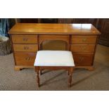 A cherrywood dressing table, fitted seven drawers, 52" wide, with three-fold mirror over, a dressing