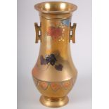 A Japanese bronzed two-handled vase, inlaid with vine leaf and bird design, 8 1/2" high, said to