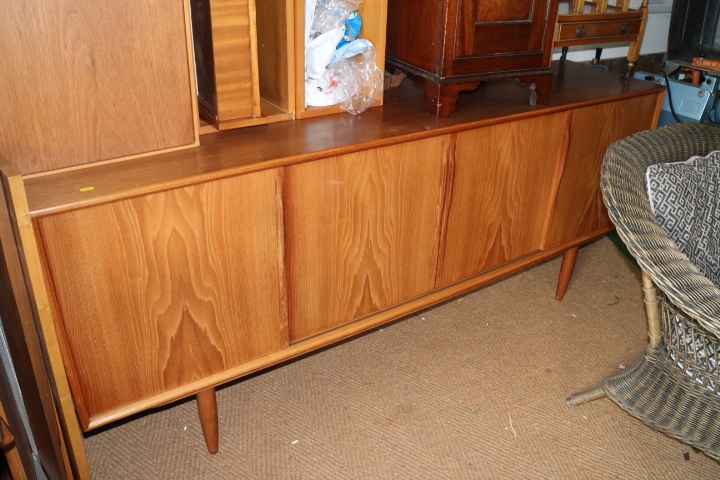 A mid 20th century Danish teak extending dining table, with two leaves, a set of eight matching - Image 2 of 2