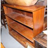 A late 19th century pitch pine open bookcase, fitted two adjustable shelves, on block base, 50"