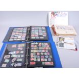 A collection of world stamps, loose and in albums