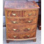 A figured walnut bowfront chest of two short and three long graduated drawers, on bracket feet,