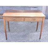 A walnut side table with string inlay, fitted two drawers, on square tapering castored supports, 41"
