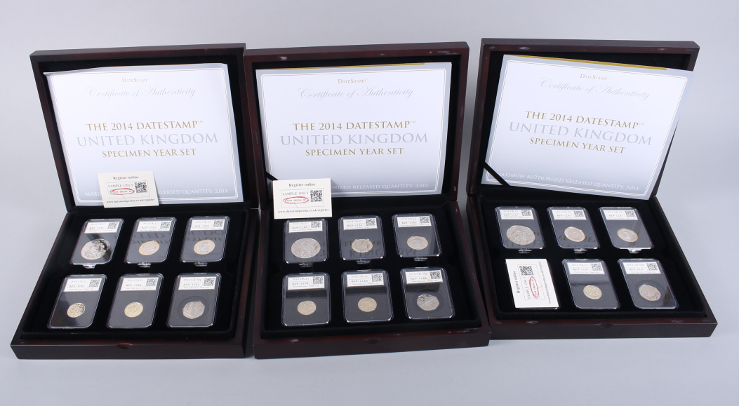 The 2014 Datestamp United Kingdom Specimen Year Set, in fitted case and two further identical sets