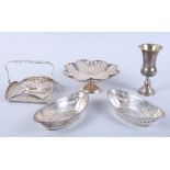 A pair of pierced silver boat-shaped baskets, a pierced silver pedestal dish, a pierced silver swing