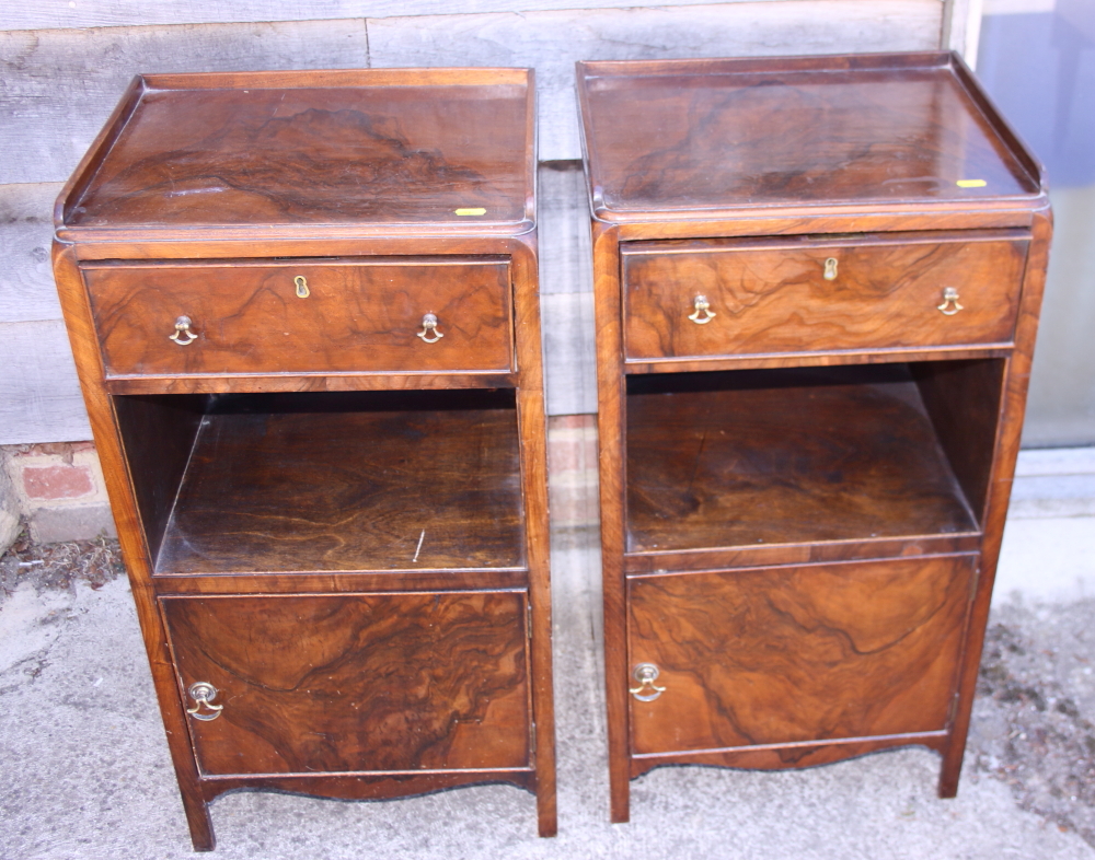 A pair of 1930s figured walnut tray top bedside cabinets, fitted drawer over recess and cupboard,