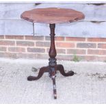 A late 19th century mahogany shape top occasional table, on turned column and tripod splay supports,