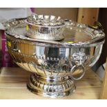 A collection of silver plate, including a punch bowl with lion mask ring handles, a tray with