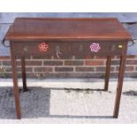 An Edwardian mahogany side table, fitted two drawers, on moulded supports, 36" wide